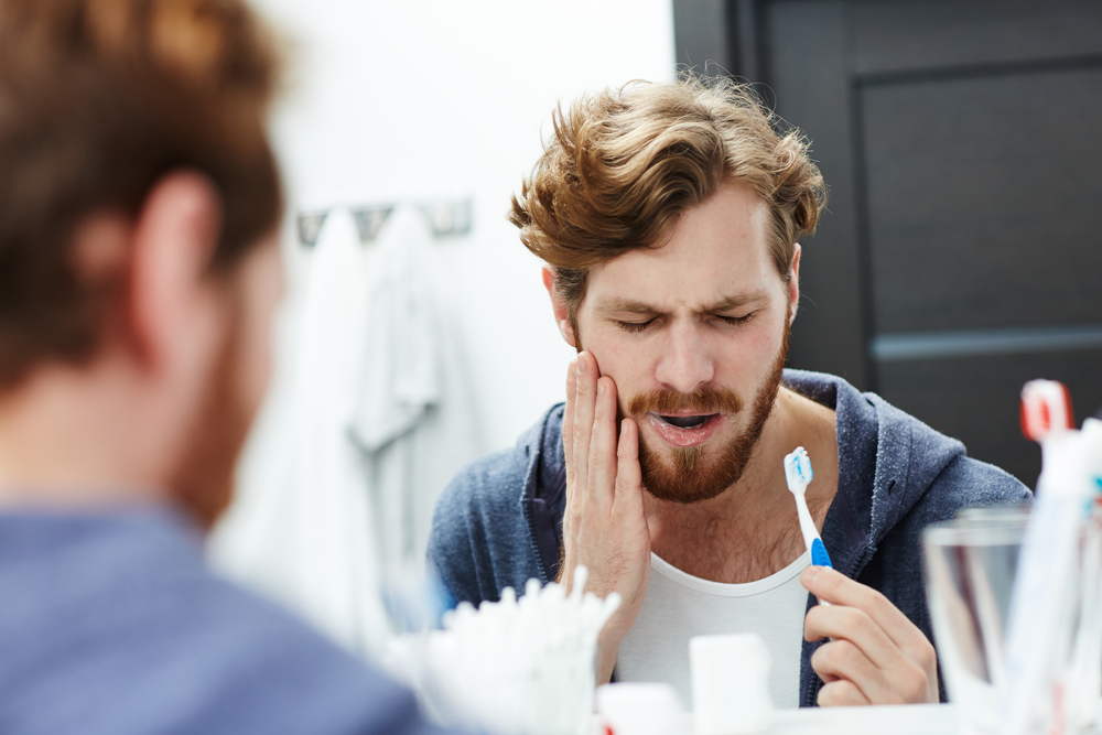 What causes sudden tooth sensitivity?